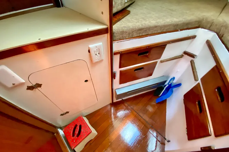 Slide: The Image of Interior of 1977 Allied Princess Cutter with wooden cabinetry and storage compartments. - 22