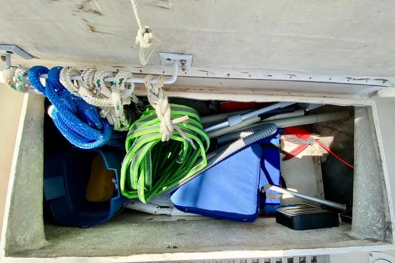 Slide: The Image of Storage compartment on 1977 Allied Princess Cutter with ropes and equipment. - 29