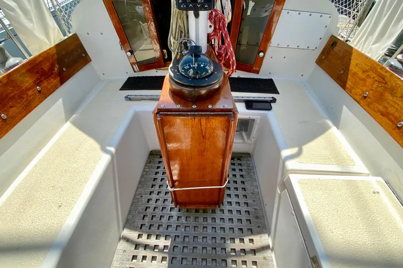 Slide: The Image of 1977 Allied Princess Cutter cockpit with wooden accents and nautical compass. - 32