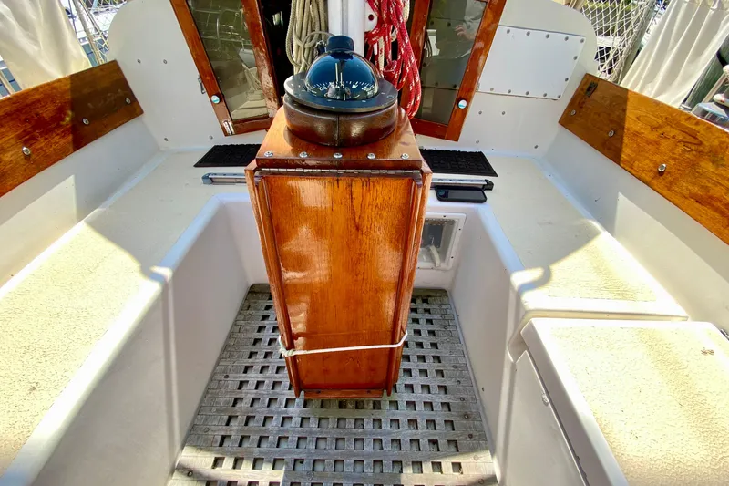Slide: The Image of 1977 Allied Princess Cutter cockpit with wooden details and nautical compass. - 33