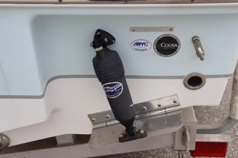 Slide: The Image of 2023 Sea Hunt Ultra 234 boat with Bennett Marine trim tab and ABYC certification. - 4