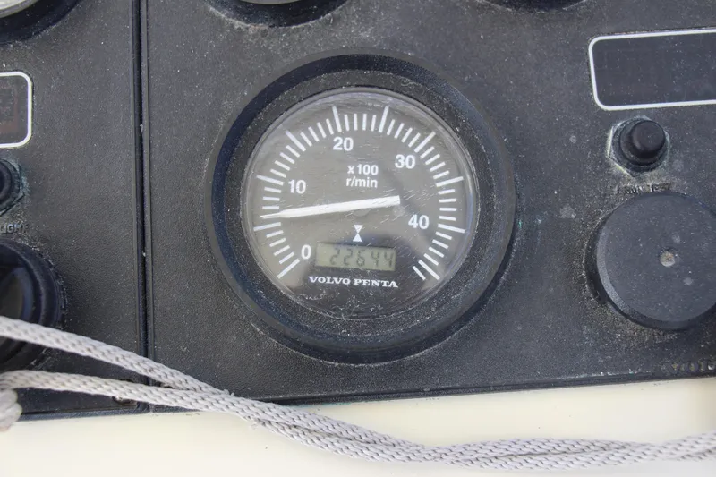 Slide: The Image of Close-up of a Volvo Penta tachometer on a 2004 Carolina Classic 28 boat. - 16