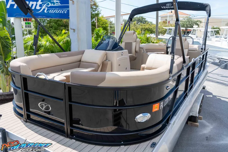 Slide: The Image of 2022 Veranda Relax VR25RC pontoon boat with beige seating and black exterior. - 10