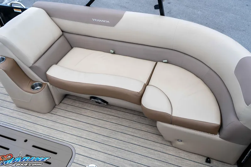 Slide: The Image of 2022 Veranda Relax VR25RC boat seating with beige and brown upholstery, featuring cup holders. - 12