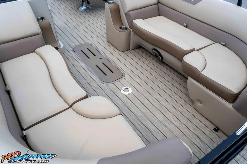 Slide: The Image of 2022 Veranda Relax VR25RC boat interior with beige seating and striped flooring. - 14
