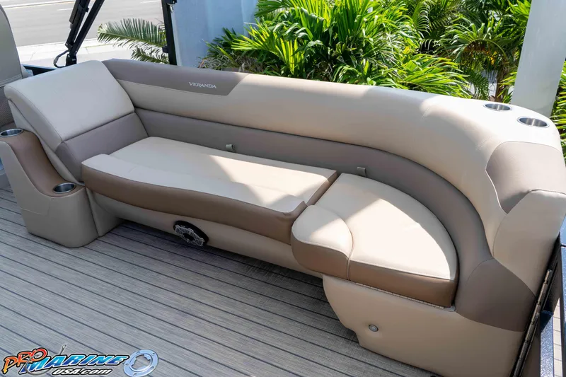 Slide: The Image of 2022 Veranda Relax VR25RC boat seating with beige upholstery and cup holders. - 19