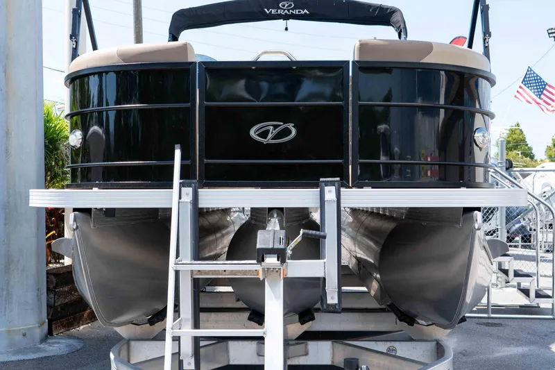 Slide: The Image of 2022 Veranda Relax VR25RC pontoon boat on display, featuring sleek black design. - 2