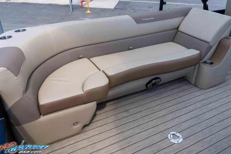 Slide: The Image of 2022 Veranda Relax VR25RC boat seating with beige upholstery and cup holders. - 21