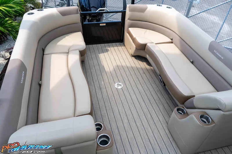 Slide: The Image of Luxurious 2022 Veranda Relax VR25RC pontoon boat interior with plush seating and cup holders. - 23