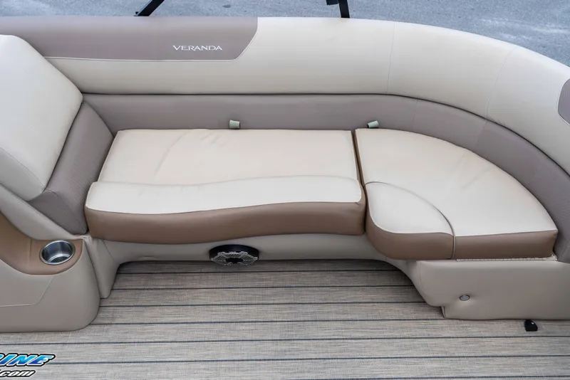 Slide: The Image of Luxurious seating on 2022 Veranda Relax VR25RC pontoon boat, featuring beige and brown upholstery. - 27
