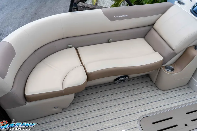 Slide: The Image of 2022 Veranda Relax VR25RC boat interior with beige and brown seating. - 28
