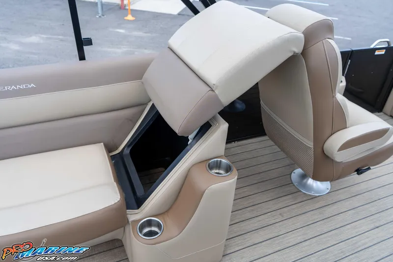 Slide: The Image of 2022 Veranda Relax VR25RC boat interior with beige seating and cup holders. - 33