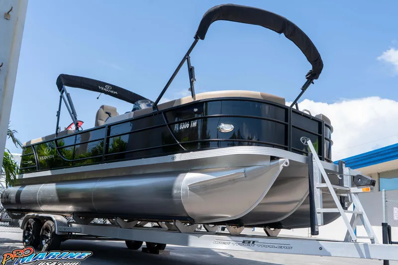 Slide: The Image of 2022 Veranda Relax VR25RC pontoon boat on trailer, sunny day, blue sky background. - 8