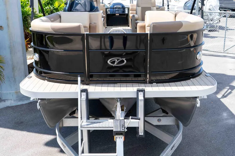 Slide: The Image of 2022 Veranda Relax VR25RC pontoon boat on trailer, featuring sleek black exterior. - 9