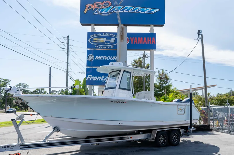 Slide: The Image of 2022 Sea Hunt Gamefish 27 Coffin Box boat on trailer at Pro Marine dealership. - 0