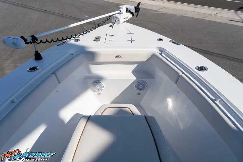 Slide: The Image of 2022 Sea Hunt Gamefish 27 Coffin Box boat interior with seating and fishing rod holders. - 13