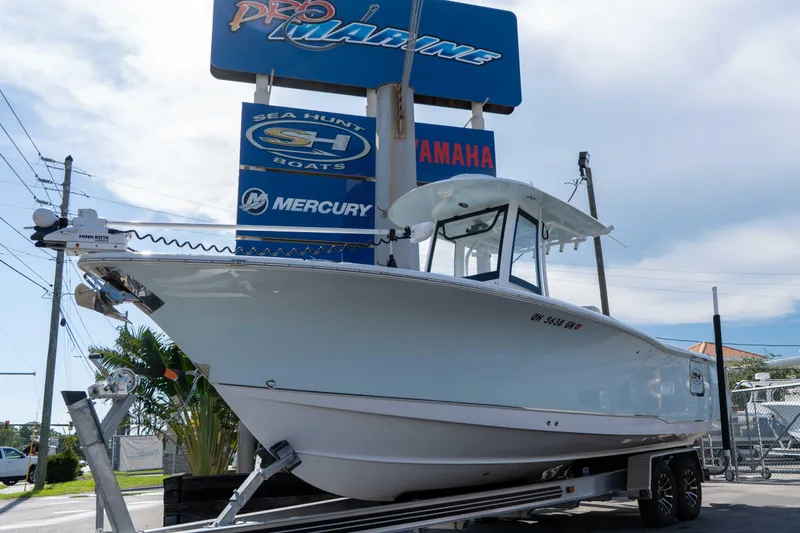 Slide: The Image of 2022 Sea Hunt Gamefish 27 Coffin Box boat displayed at Pro Marine dealership. - 2