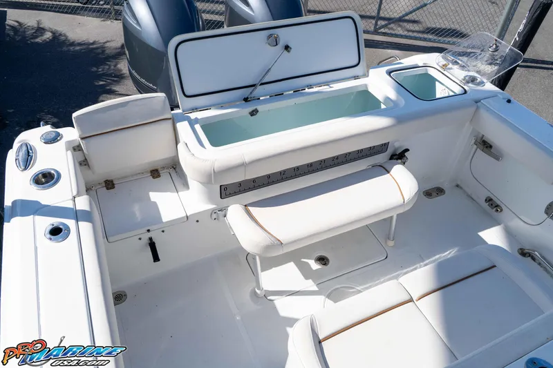 Slide: The Image of 2022 Sea Hunt Gamefish 27 Coffin Box boat interior with seating and storage compartments. - 20
