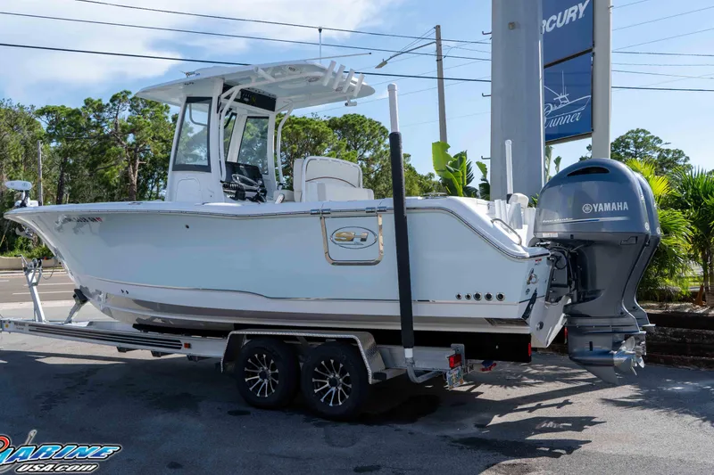 Slide: The Image of 2022 Sea Hunt Gamefish 27 Coffin Box boat on trailer with Yamaha engine. - 3