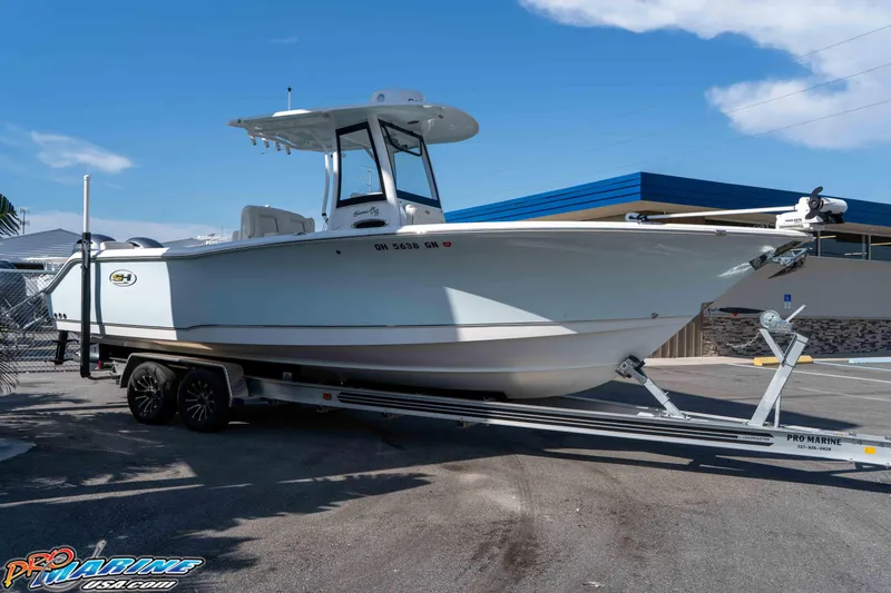 Slide: The Image of 2022 Sea Hunt Gamefish 27 Coffin Box boat on trailer, parked outdoors. - 8