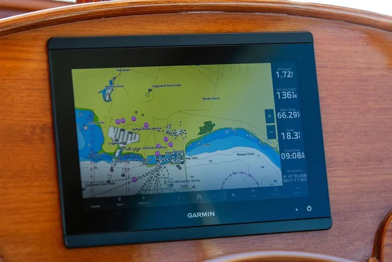 Slide: The Image of Garmin navigation display on 2023 Hinckley Picnic Boat 34 S, showing nautical chart and data. - 17