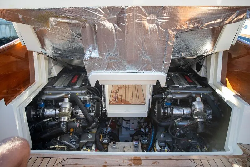 Slide: The Image of Engine compartment of 2023 Hinckley Picnic Boat 34 S, showcasing dual engines and insulation. - 28