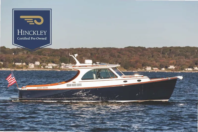 The Image of 2023 Hinckley Picnic Boat 34 S cruising on water, certified pre-owned. - 0