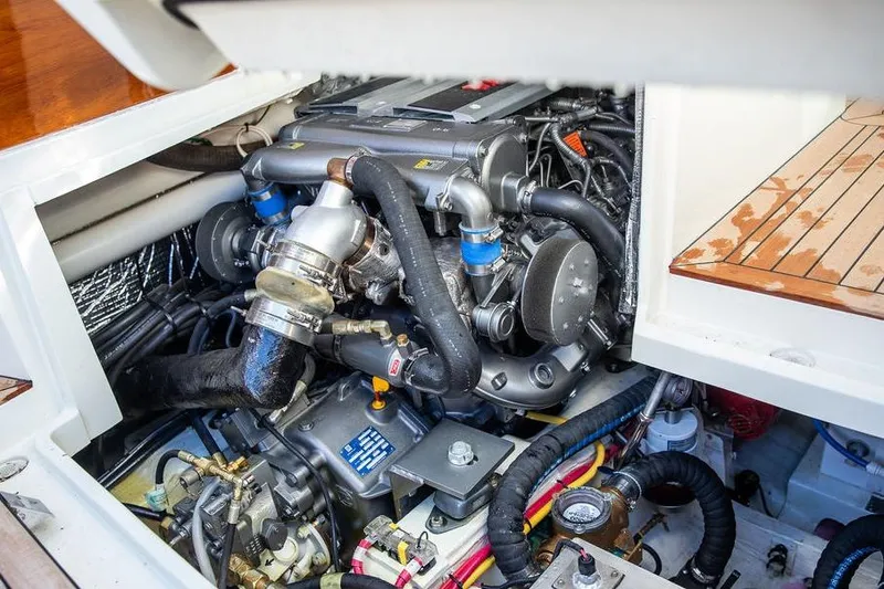 Slide: The Image of Engine compartment of 2023 Hinckley Picnic Boat 34 S, showcasing detailed mechanical components. - 27