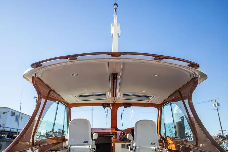 Slide: The Image of 2023 Hinckley Picnic Boat 34 S cockpit with elegant design and modern features. - 9