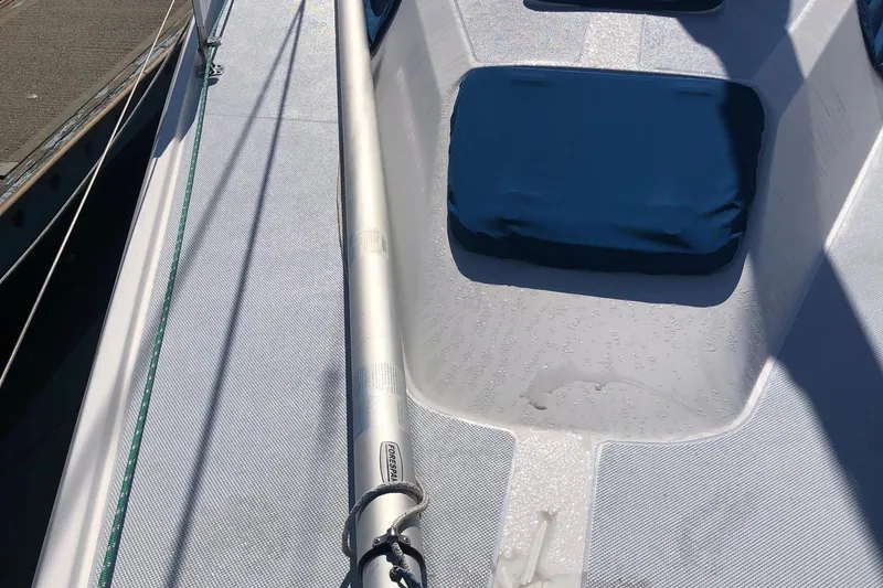 Slide: The Image of Deck of 2002 Catalina 42 MkII sailboat with blue cushions and rigging. - 17