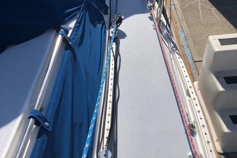 Slide: The Image of Close-up of 2002 Catalina 42 MkII sailboat deck with blue cover and rigging. - 18