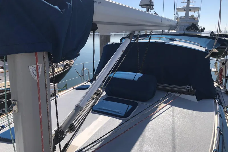 Slide: The Image of 2002 Catalina 42 MkII sailboat deck with blue covers and rigging. - 20
