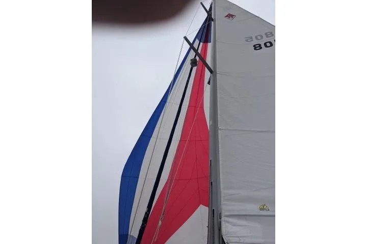 Slide: The Image of Sails of a 2002 Catalina 42 MkII yacht against a cloudy sky. - 23