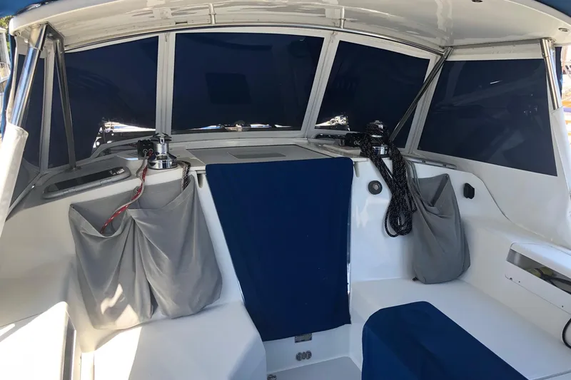 Slide: The Image of Interior view of a 2002 Catalina 42 MkII sailboat cockpit with blue and gray covers. - 30