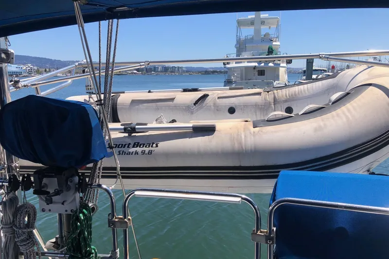 Slide: The Image of Catalina 42 MkII sailboat with inflatable dinghy, docked in a marina, 2002 model. - 35