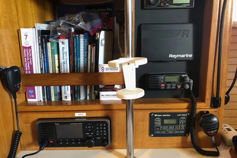 Slide: The Image of Navigation equipment and manuals on a 2002 Catalina 42 MkII sailboat. - 4