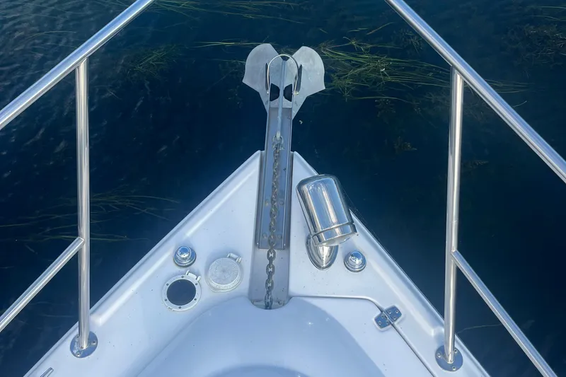 Slide: The Image of Bow of 2006 Four Winns 318 Vista boat with anchor and railing. - 10