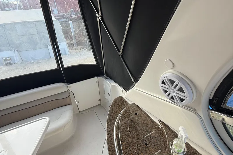 Slide: The Image of Interior of 2006 Four Winns 318 Vista boat with seating and speaker. - 13