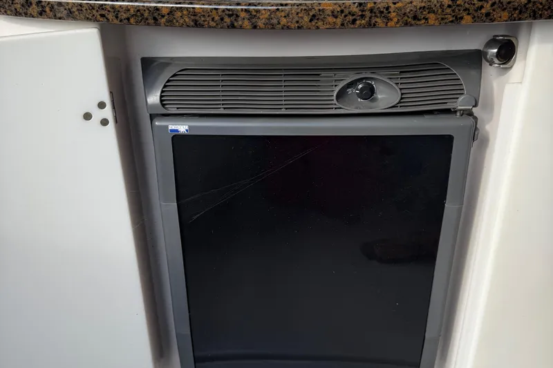 Slide: The Image of Built-in refrigerator in 2006 Four Winns 318 Vista boat interior. - 15