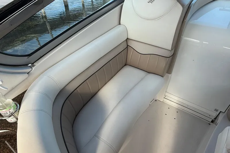 Slide: The Image of Luxurious seating on 2006 Four Winns 318 Vista boat, featuring elegant beige upholstery. - 21