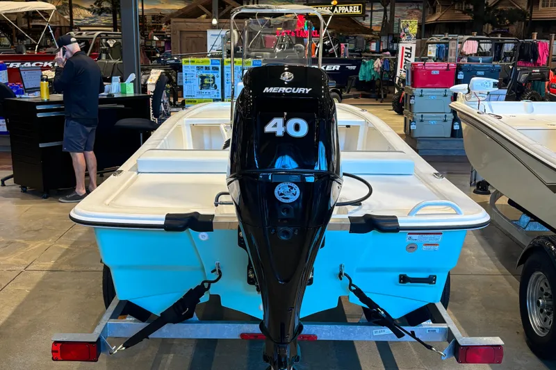 Slide: The Image of 2026 Mako Pro Skiff 13 CC with Mercury 40 engine in showroom. - 2