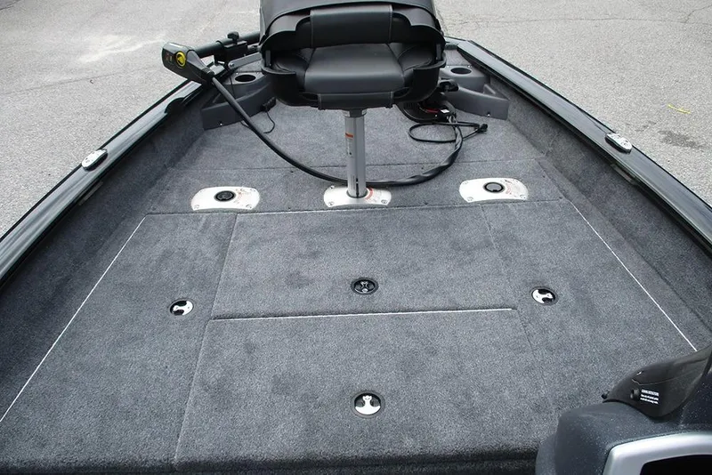 Slide: The Image of 2026 Tracker Pro Team 175 Crappie Edition boat interior with gray carpet and seating. - 10