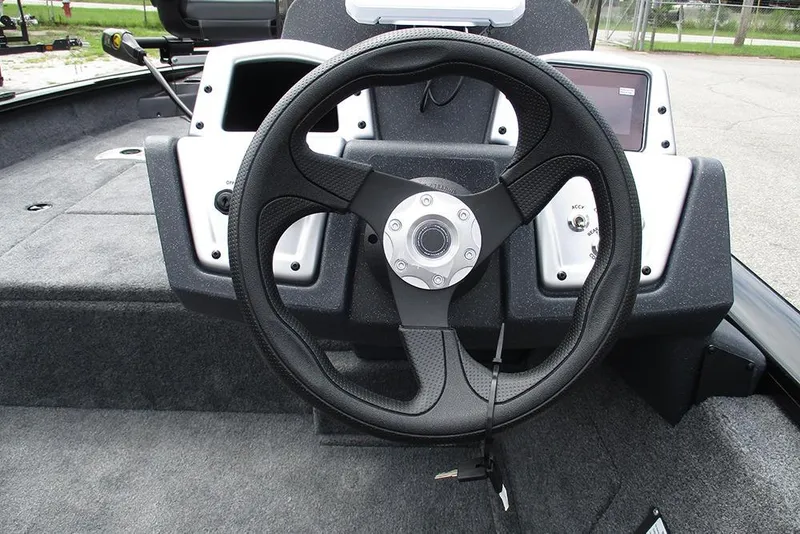 Slide: The Image of 2026 Tracker Pro Team 175 Crappie Edition boat steering wheel and dashboard. - 23