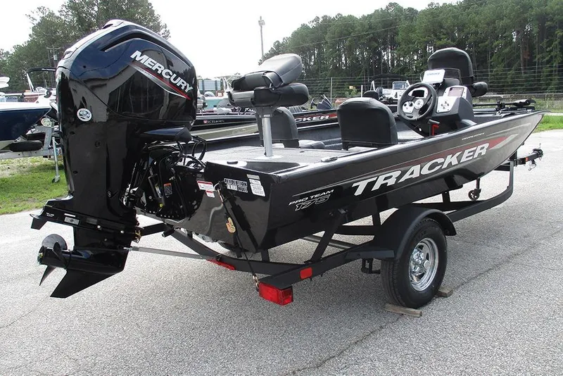 Slide: The Image of 2026 Tracker Pro Team 175 Crappie Edition boat with Mercury engine, parked on trailer. - 4