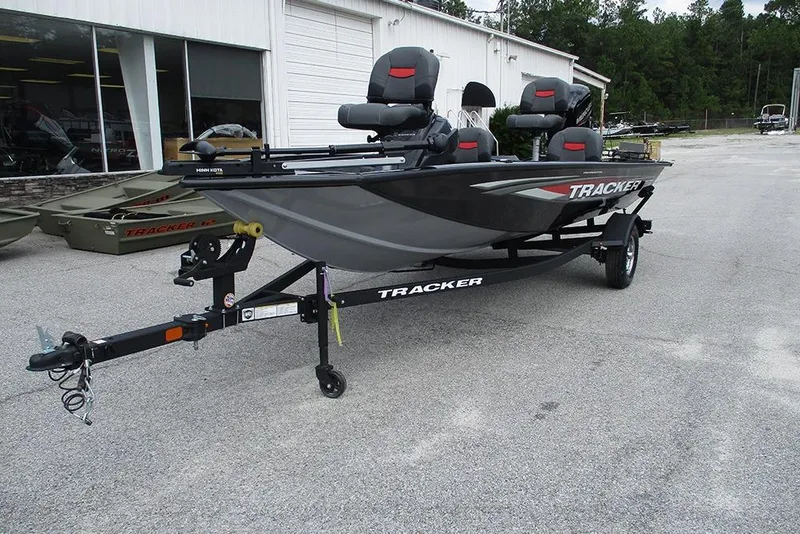 Slide: The Image of 2026 Tracker Pro Team 175 Crappie Edition boat on trailer, parked outside dealership. - 6