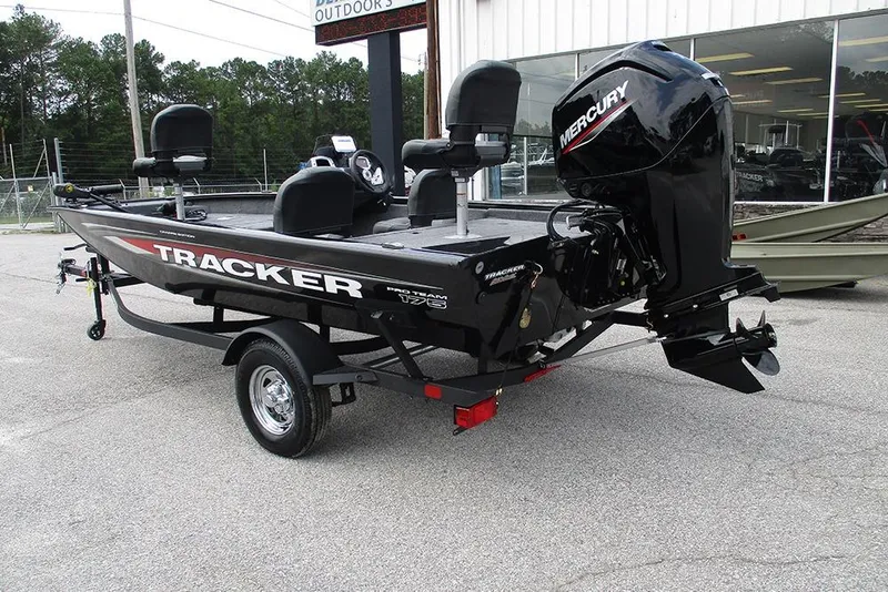 Slide: The Image of 2026 Tracker Pro Team 175 Crappie Edition boat with Mercury engine, parked outdoors. - 7