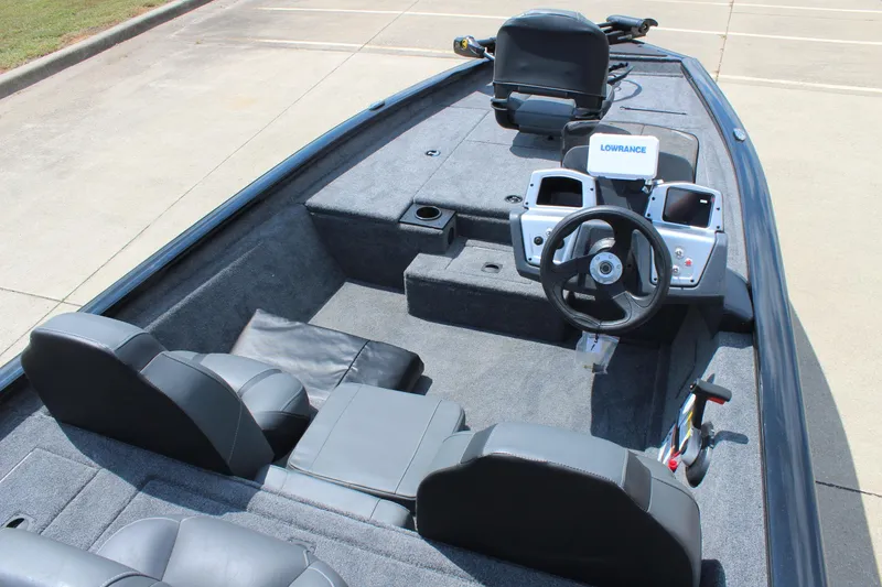 Slide: The Image of 2026 Tracker Pro Team 175 boat interior with steering wheel and seating. - 12