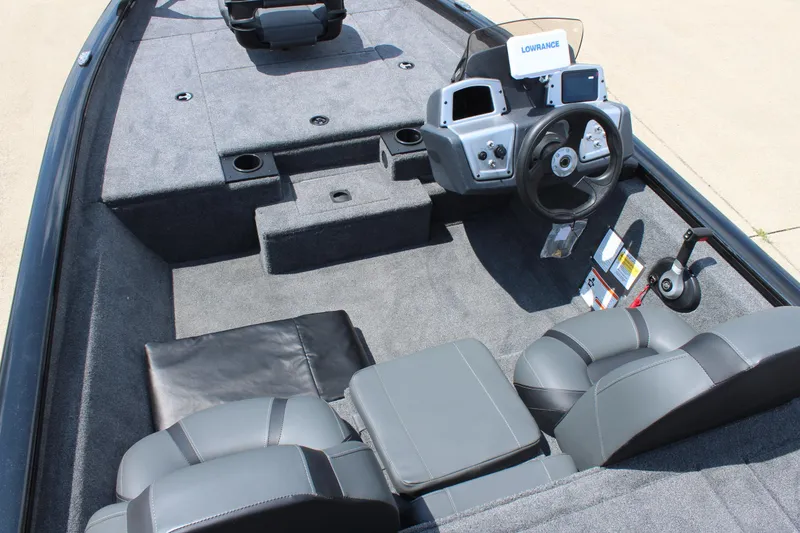 Slide: The Image of 2026 Tracker Pro Team 175 boat interior with steering console and seating. - 13