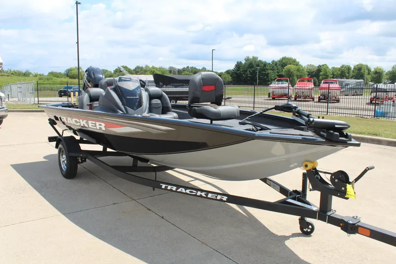 Slide: The Image of 2026 Tracker Pro Team 175 boat on trailer, parked outdoors. - 3