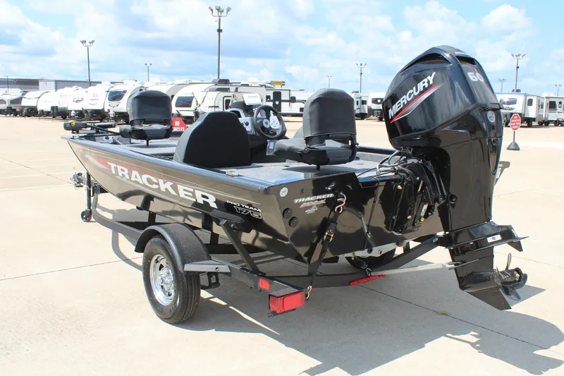 Slide: The Image of 2026 Tracker Pro Team 175 boat with Mercury engine in a parking lot. - 7